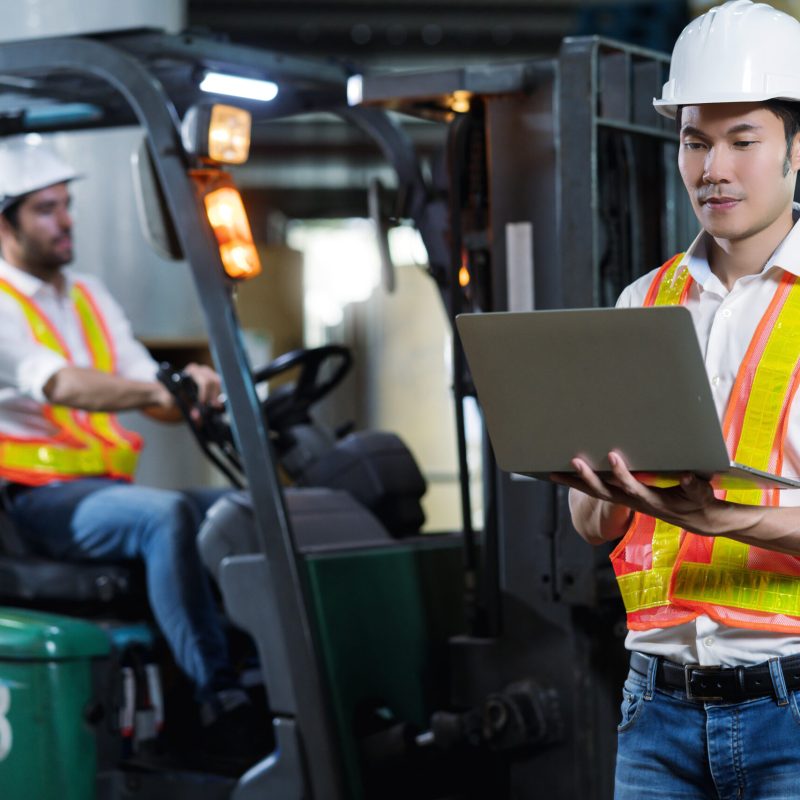 engineer staff male warehouse worker in hard hat working. walking through logistics center warehouse factory construction site logistics architect forklife driver man builder indoors background