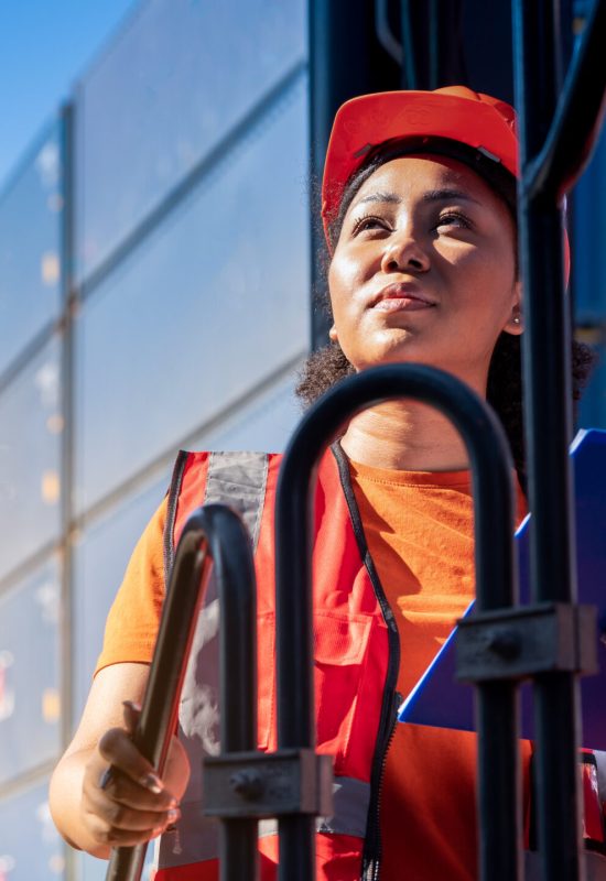 Female Foreman stay on lifting container cargo forklift check or inspect and control forklift concept service and transportation logistic.
