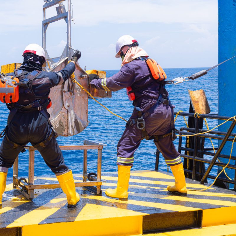 Marine experts deploying equipment for benthic organism collection